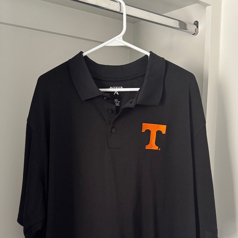 Antigua Men's Polo Shirt in Black with Tennessee Orange Emblem